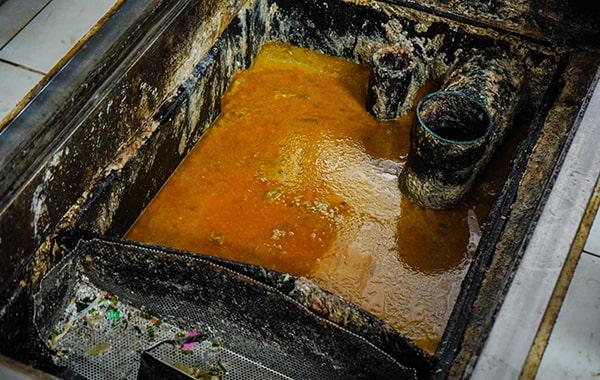 proper grease trap cleaning helps prevent grease and oil from entering the sewer system and contaminating waterways